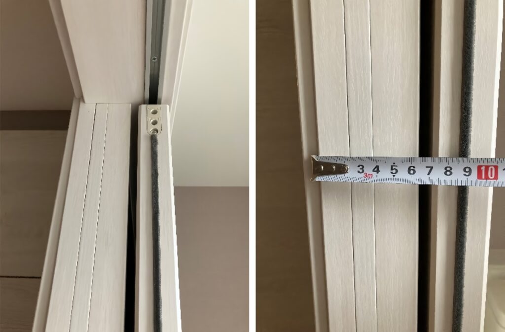 インセット引き戸の壁の厚みを計測した様子。約6.5cmを示すメジャー